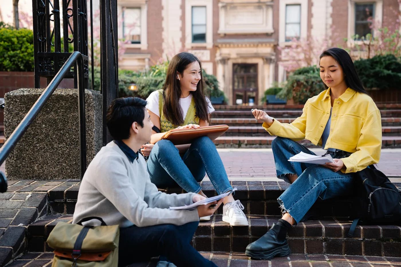 College students walking and laughing together on campus